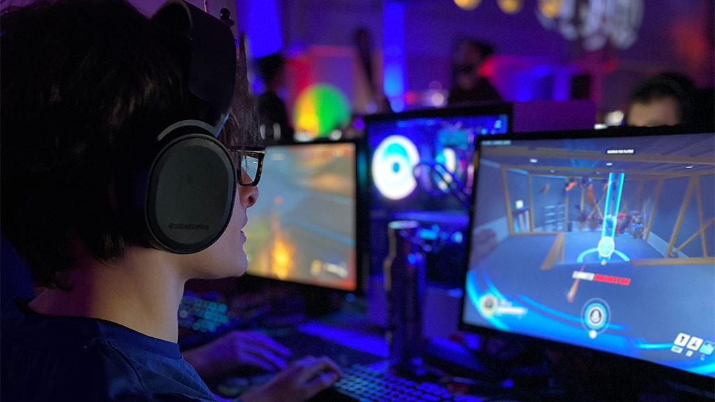 STudent playing Overwatch at an esports competition