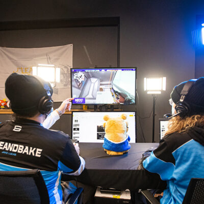 Students watching an esports match in a studio